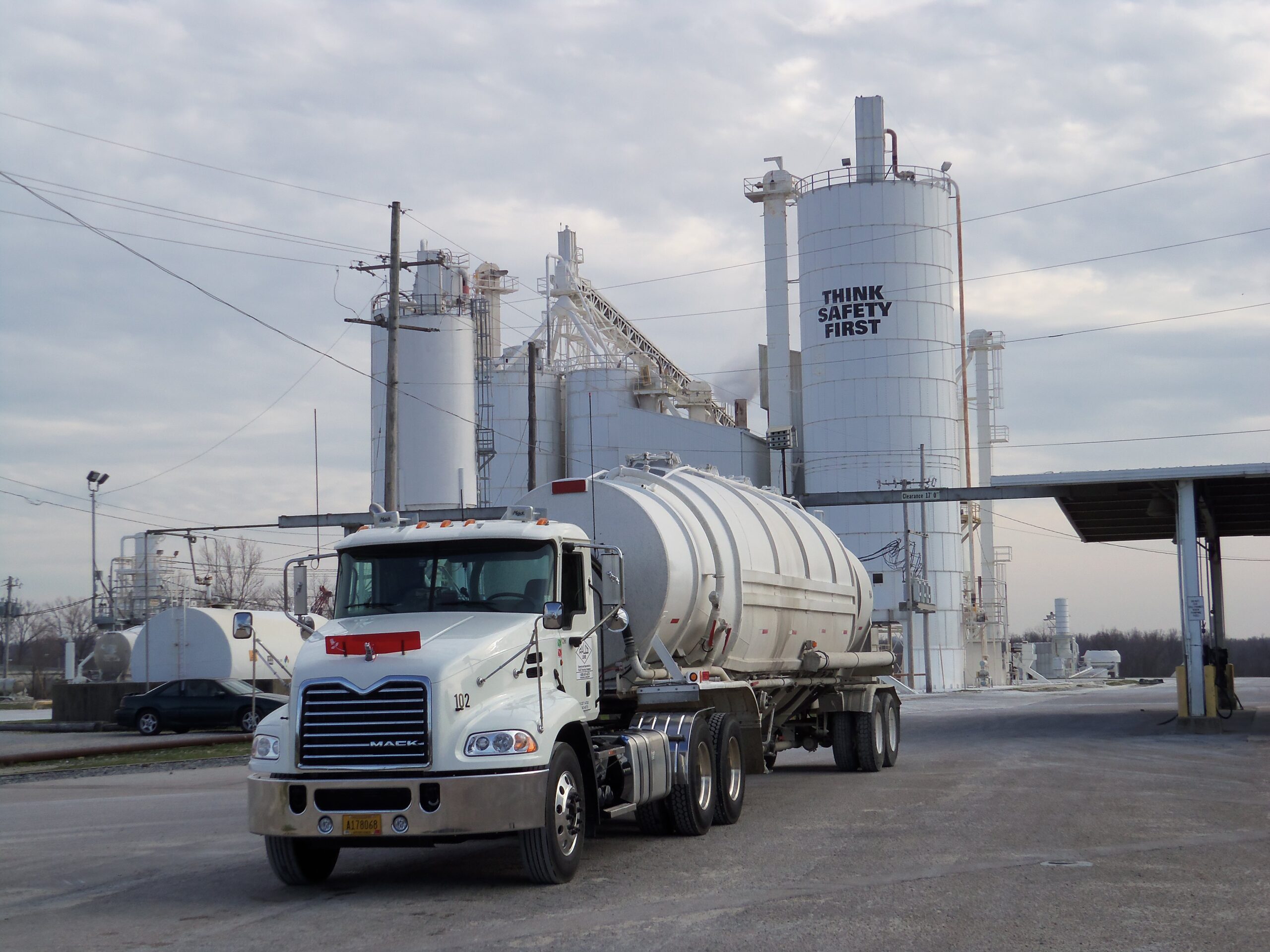 White truck in foreground as it leaves one of MLC's lime operations. Lime hydrators can be seen in the background.
